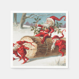 Gnomes dragging a cut tree trunk through the snow servet