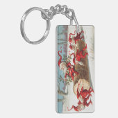 Gnomes dragging a cut tree trunk through the snow sleutelhanger (Voorkant Links)