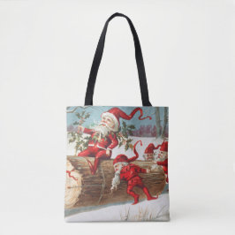 Gnomes dragging a cut tree trunk through the snow tote bag