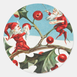 Gnomes painting holly berries in the snow ronde sticker