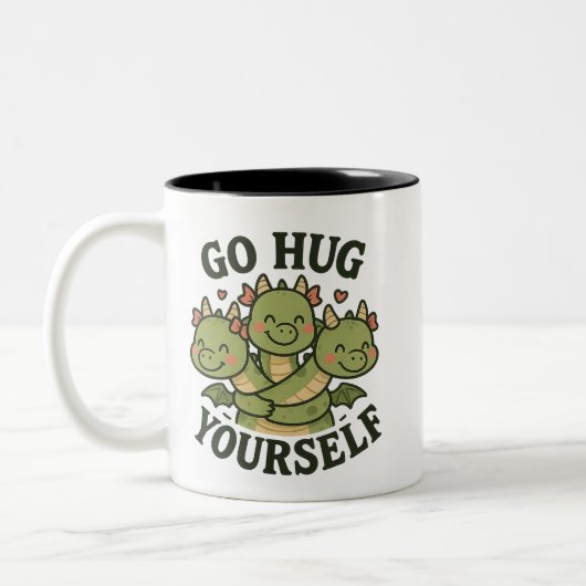 Go Hug Yourself Mug – Cute Three-Headed Dragon  Tweekleurige Koffiemok (Links)
