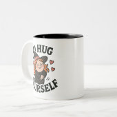 Go Hug Yourself Witch – Cute Halloween Self-Love Tweekleurige Koffiemok (Voorkant links)