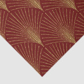 Gold art-deco patroon op rode achtergrond omhullin tissuepapier (Detail)