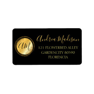 Gold Black met minimaal metalen monogram Etiket