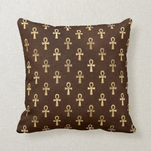 Gold Egyptische Ankh over Brown Kussen