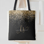 Gold Glitter Glam Monogram Naam Tote Bag<br><div class="desc">Glam Gold Glitter Elegant Monogram Tote Bag Easily personalize this trendy chic tote bag design featuring elegant gold sparkling glitter on a black background. The design features your handwritten script monogram with pretty swirls and your name.</div>