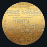 Gold International Kerstmis Navidad R Sticker<br><div class="desc">Wens Kerstmis in veel talen : Fröhliche Weihnachten - Feliz Navidad - Feliz Natal - Joyeux Noel - Vrolijk Kerstfeest - Buone Feste Natalizie - God jul - Merry Kerstmis, met dit prachtige ontwerp zoals uitgesneden en papercut stijl (wit voor het letterschrift) op gouden achtergrond. Traditionele ronde sticker voor Kerstmis....</div>