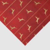 Gold kerstrenrendiertje op de rode lospagina tissuepapier (Detail)