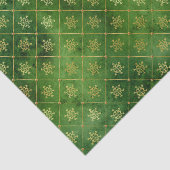 Gold kerstsnowflakes op groen tissuepapier (Detail)