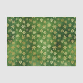 Gold kerstsnowflakes op groen tissuepapier