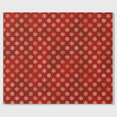 Gold kerstsnowflakes op rood cadeaupapier (Vlak)