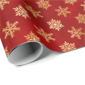 Gold kerstsnowflakes op rood cadeaupapier (Rol Hoek)