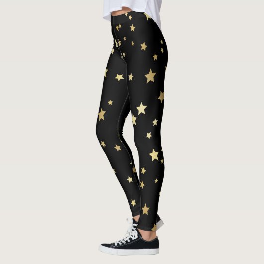 Gold Stars op zwarte achtergrond Leggings (Links)