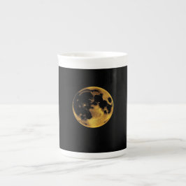 Gold textured moon on dark black porselein kop
