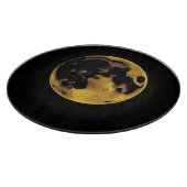 Gold textured moon on dark black snijplank (Hoek)