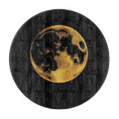Gold textured moon on dark black snijplank (Voorkant)