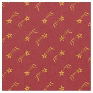 Gold vallende ster op rood stof