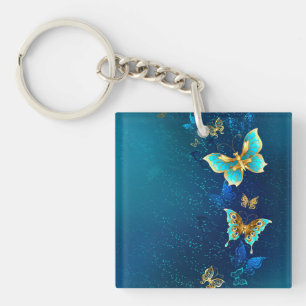 Golden Butterflies op een blauwe achtergrond Sleutelhanger