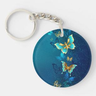 Golden Butterflies op een blauwe achtergrond Sleutelhanger