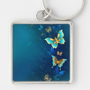 Golden Butterflies op een blauwe achtergrond Sleutelhanger
