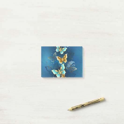 Golden butterflies post-it® notes (Op bureau)