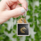 Golden drakensilhouet op zwart leder sleutelhanger (Hand)