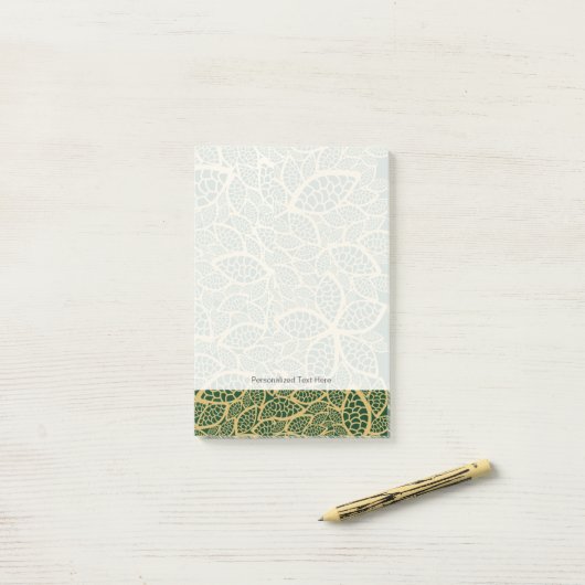 Golden leaf op groene achtergrond post-it® notes (Op bureau)