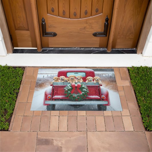 Golden Retriever Puppies in rode kersttruck Deurmat (Buiten)