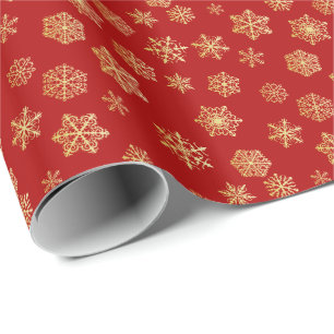 Golden sneeuwvlokken op een rode achtergrond cadeaupapier