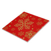 Golden sneeuwvlokken op rood tegeltje (Zijkant)