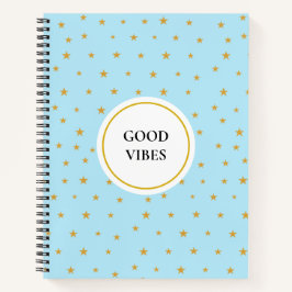 Golden sterren op lichtturkooisblauw notitieboek