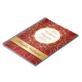 Golden zwemmen op een notebook met een rode bruilo notitieboek (Linkerzijde)