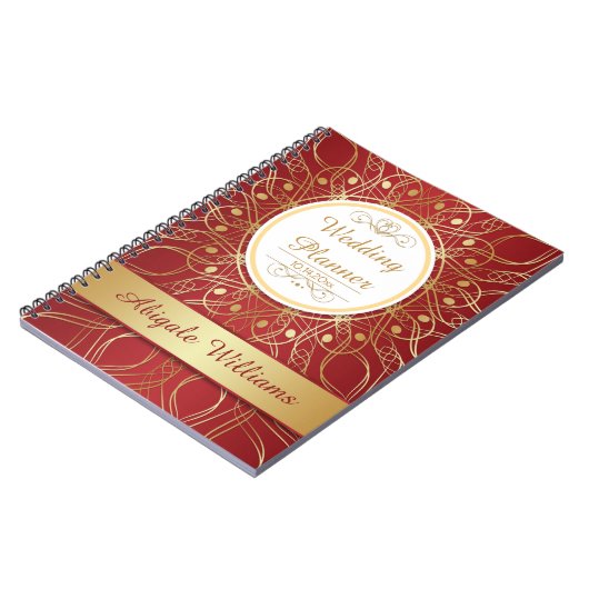 Golden zwemmen op een notebook met een rode bruilo notitieboek (Linkerzijde)