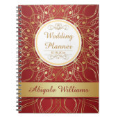 Golden zwemmen op een notebook met een rode bruilo notitieboek (Voorkant)