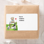 Golf Baby zit op golfkar in golfbaan Etiket (Insitu)