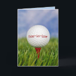 Golf Ball on T-shirt for Son-in-law's Birthday Car Kaart<br><div class="desc">Close-up van golfbal op rood t-shirt in groen gras voor de schoonzoon. Tekst op bal kan worden bewerkt.</div>