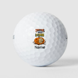 Golf Halloween met een enge pompoen Golfballen