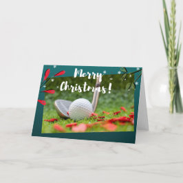 Golf ijzer en bal is op groene kerst kaart