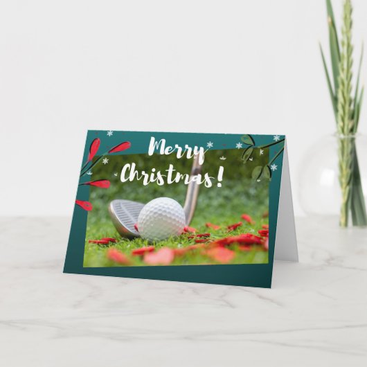 Golf ijzer en bal is op groene kerst kaart (Voorkant)