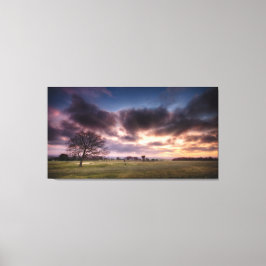 Golfbaan landschap met een rode zonsondergang heme canvas afdruk