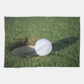 Golfbal aan de rand van het gat theedoek (Horizontaal)