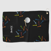 Golfbal en kleurrijke t - shirts op zwarte achterg golfhanddoek (Horizontaal)