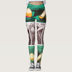 Golfbal en rotter op groen leggings
