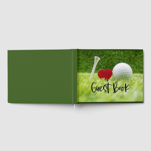 Golfbal en t-shirt op groen gras met liefde gastenboek (Volledig)