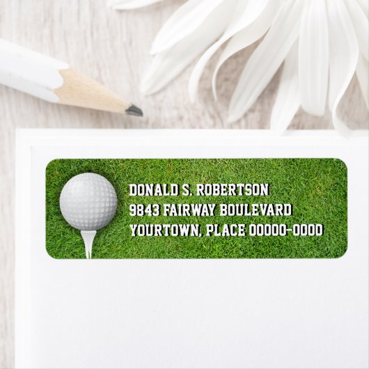 Golfbal in de gras etiket (Insitu)