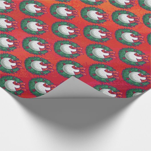 Golfbal in het grote patroon op rood cadeaupapier (Hoek)