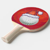 Golfbal in Santa Hat op rood Tafeltennisbatje (Voorkant Gekanteld)