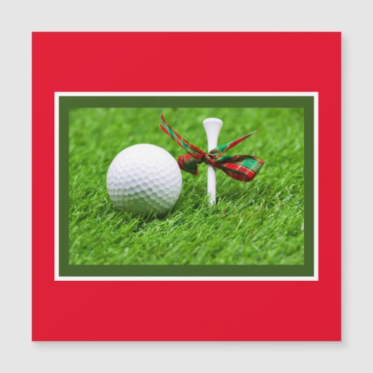 Golfbal Kerst met t-shirt op groen gras (Voorkant)