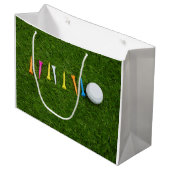 Golfbal met t - shirts op groengras golf groot cadeauzakje (Voorkant Gekanteld)