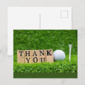 Golfbal met woord bedankt op groen gras briefkaart (Voorkant / Achterkant)
